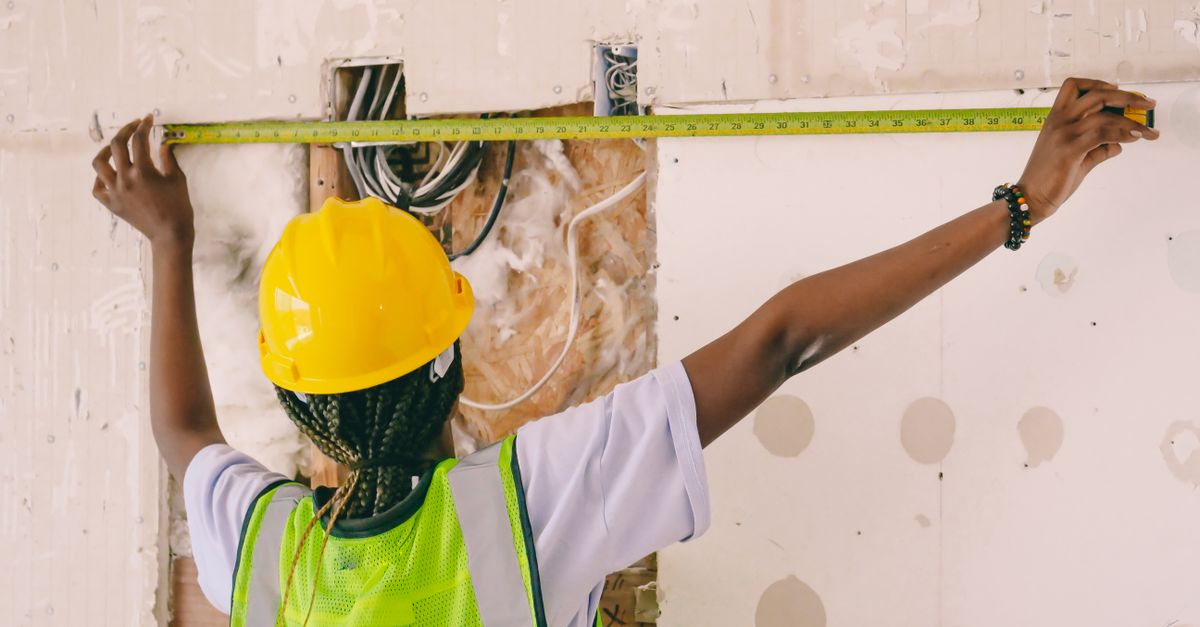 Tape measure against a wall during inspection